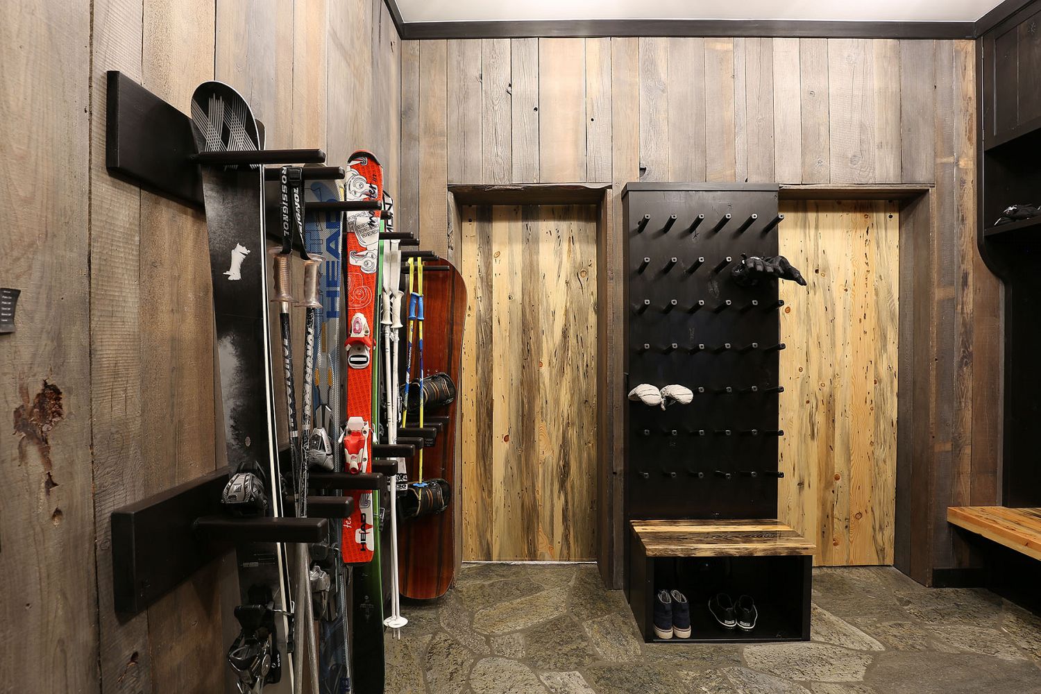 Bootroom with custom doors, boot dryer, and benches